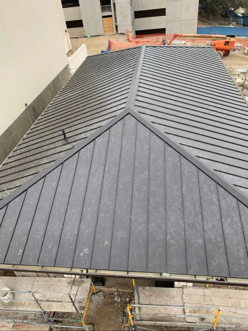 Commercial metal roof construction with crane equipment in Shawangunk