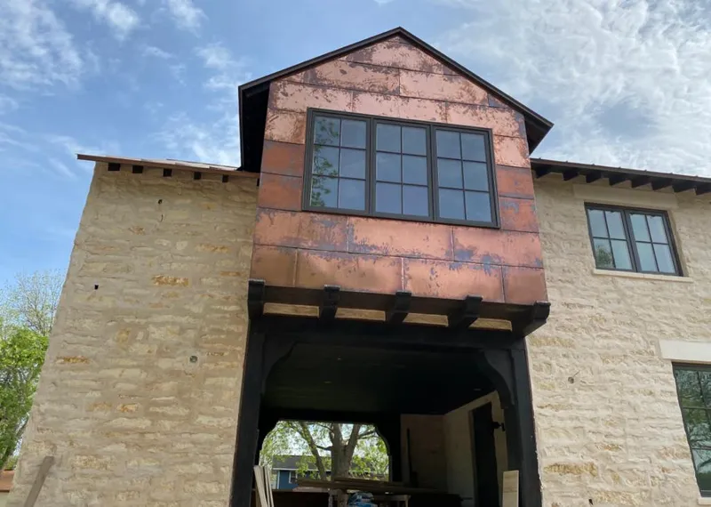 Copper metal panel facade on a stone building for Skylight Installation in Shawangunk