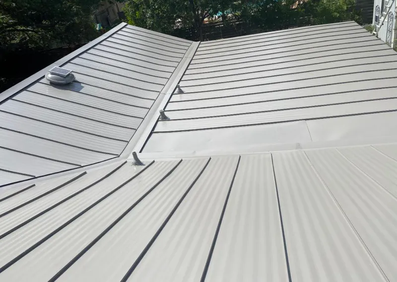 Solar attic fan installed on a metal roof for Roof Ventilation in Shawangunk